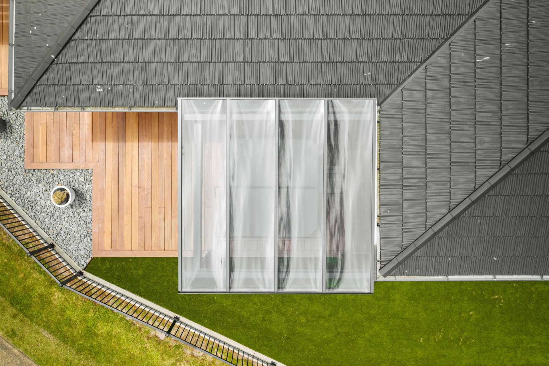 The VelaSun is a fixed outdoor pergola system with infill available as grey tinted polycarbonate or glass of your choice.