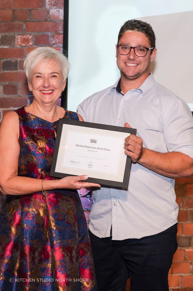 Michael Robertson receiving Kitchen of the Year 2025 and People’s Choice 2025 awards.