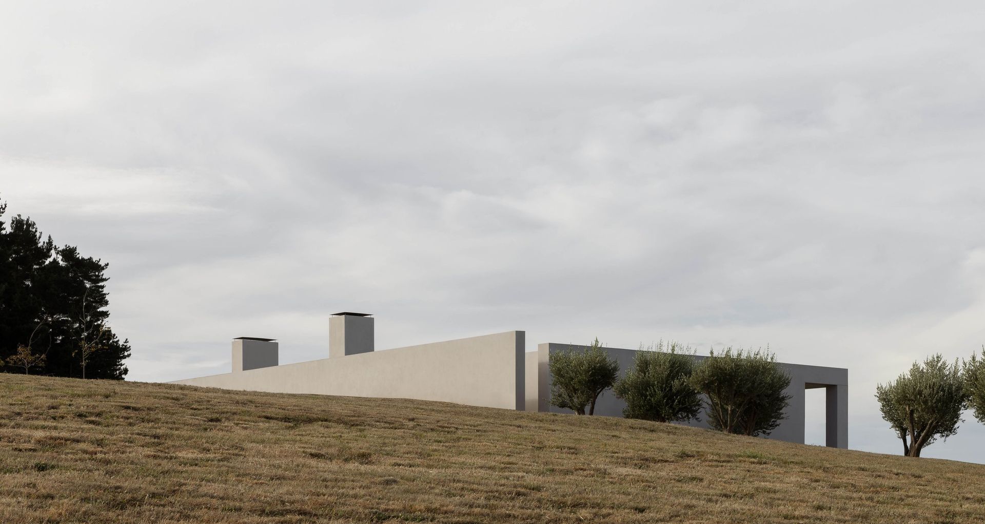 At EPSC Residence, a restrained composition of low, monolithic volumes settles into the Mornington Peninsula landscape, showing how fewer architectural gestures can create greater presence.