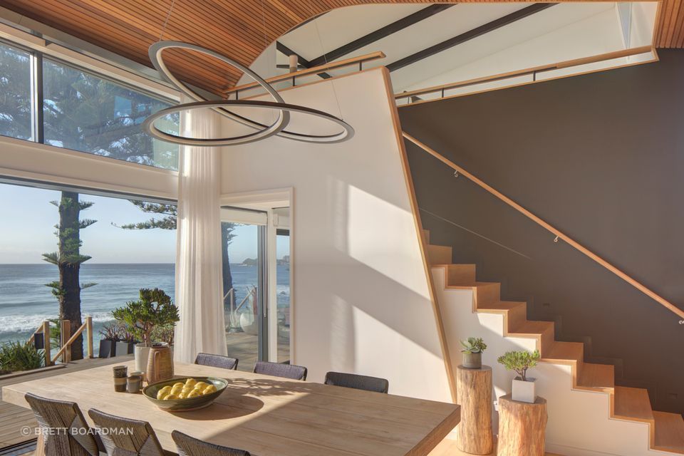 The sculptural pendant gives a nod to the curvacious form of the ceiling.