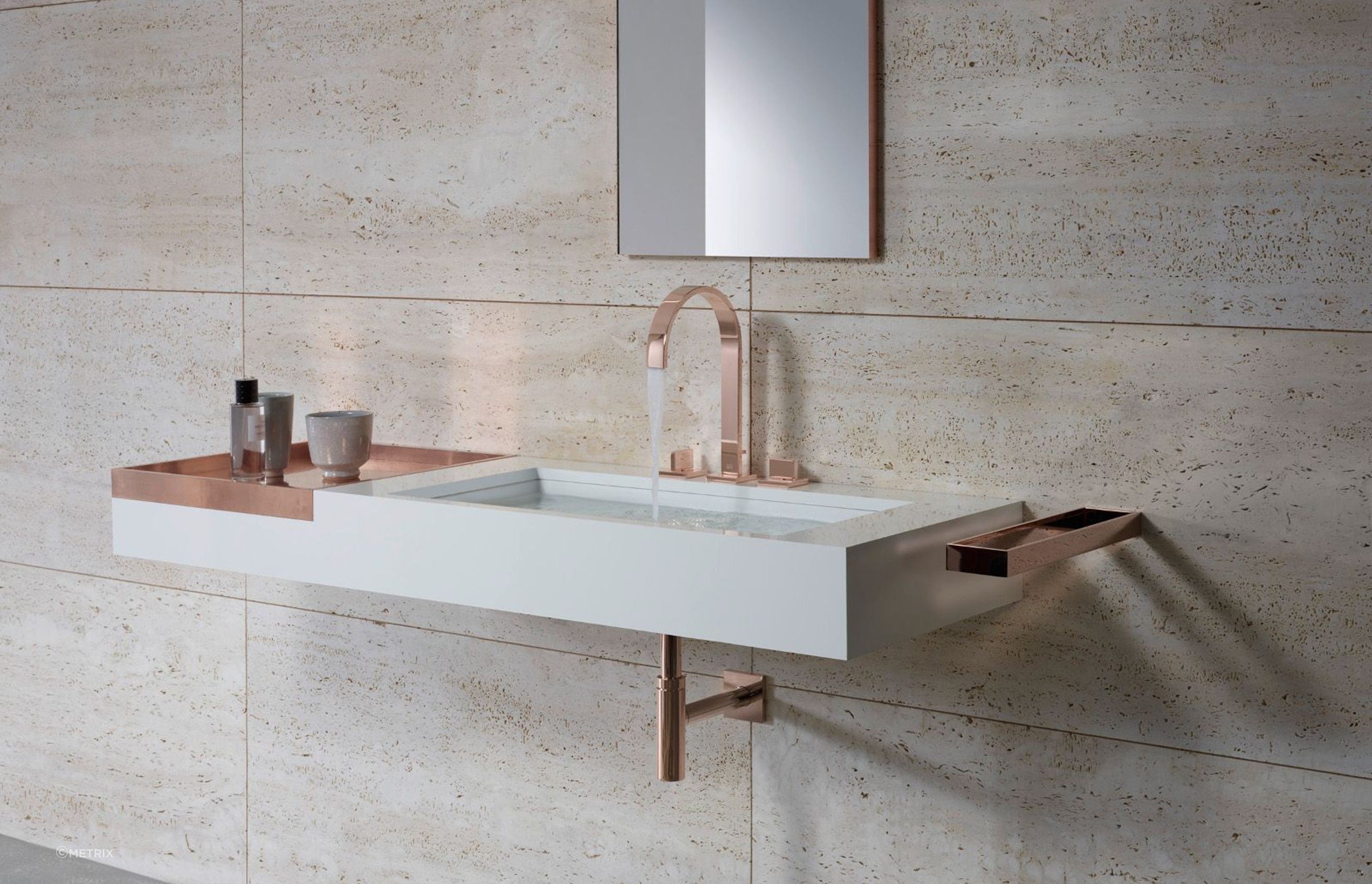The elegant MEM Bathroom Collection by Dornbracht in pink gold with matching shower fittings available