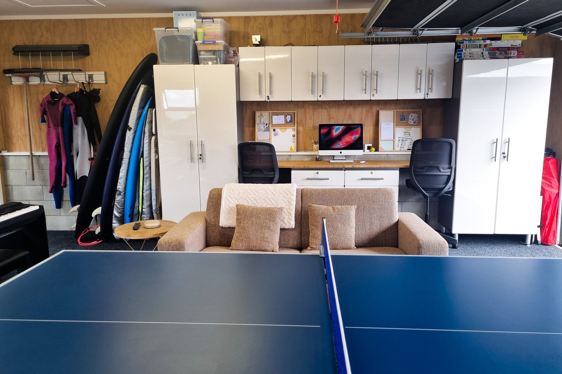 For the clients’ two daughters, a combination of base drawer units with bench tops and wall cabinets was used to create a practical dual-workspace.