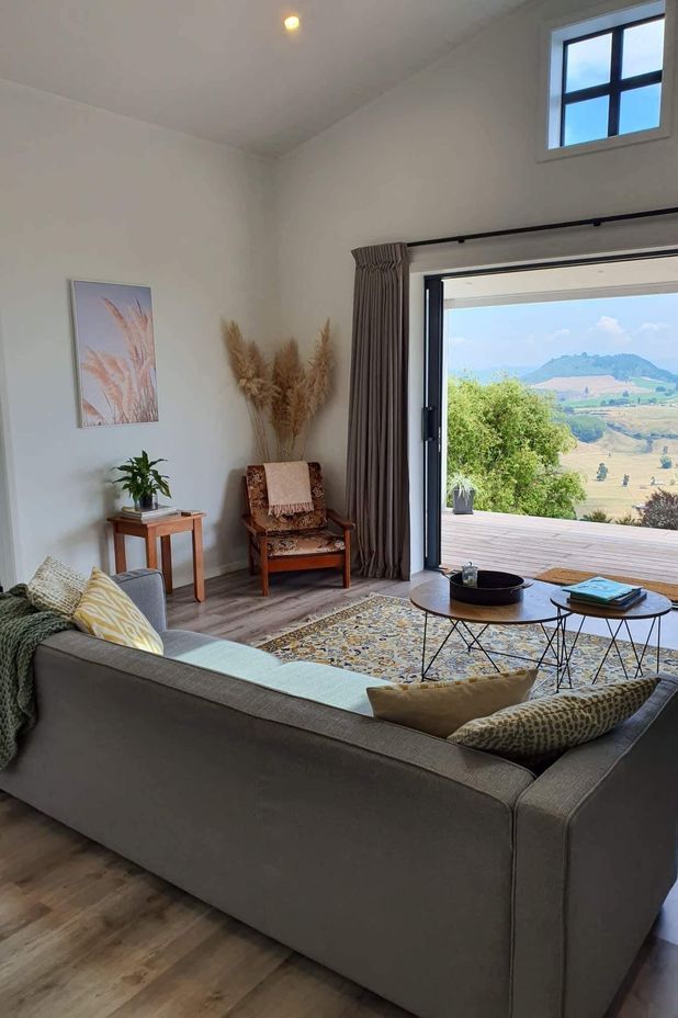 The open-plan living area features a pitched ceiling to make the space feel larger.