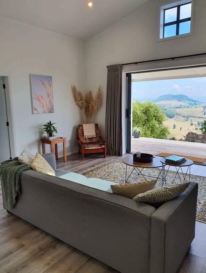The open-plan living area features a pitched ceiling to make the space feel larger.
