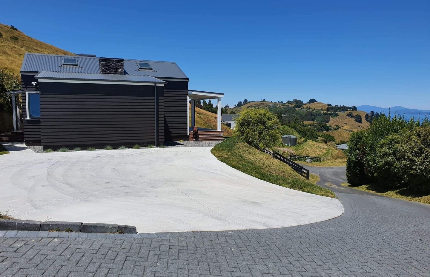 A covered deck at the front of the home extends the living space.