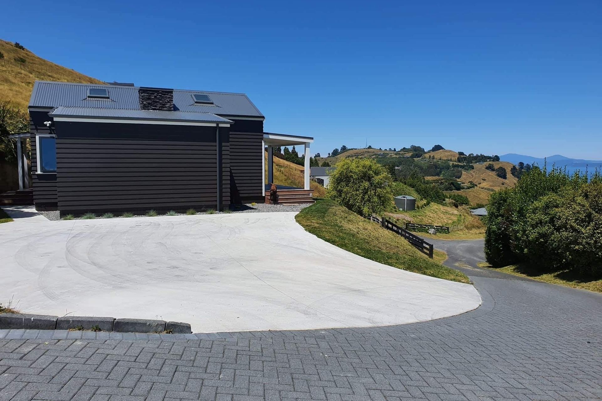 A covered deck at the front of the home extends the living space.