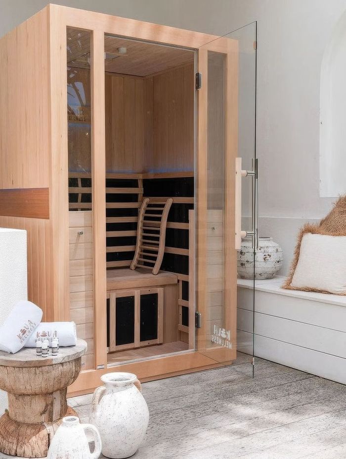 Infrared saunas use infrared light via heating panels to directly warm the body.