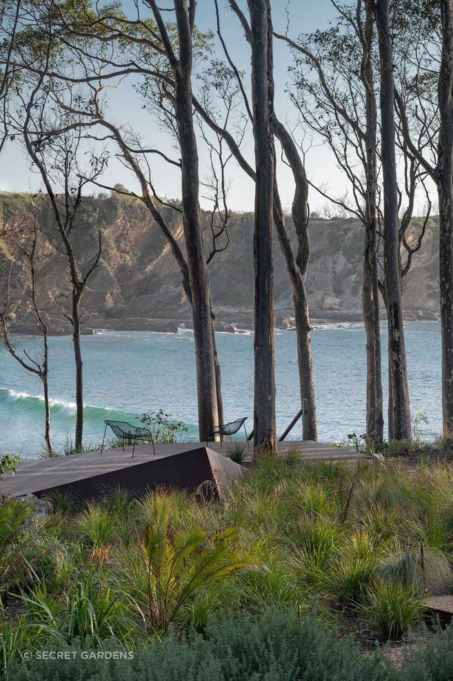 A network of paths and destination points draws people through the restored landscape, opening framed views across the narrow coastal headland.