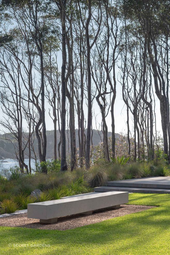 Restrained planting restores cover to the once-exposed site, while robust concrete elements respond to the landscape’s ongoing bushfire risk.