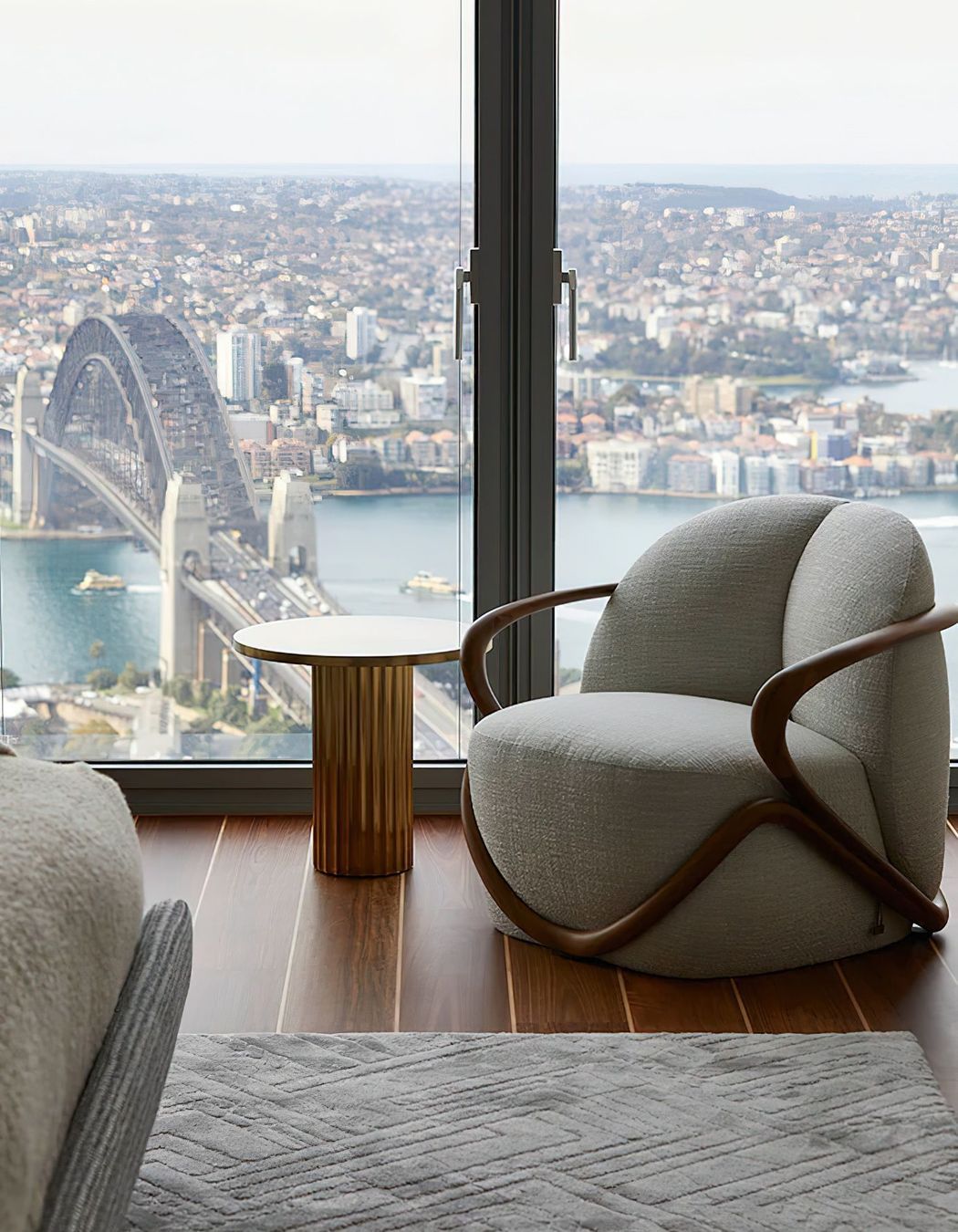 The Hug Armchair designed by Rossella Pugliati for Giorgetti, with the Allure side table by Baxter. Photo © Martin Mischkulnig