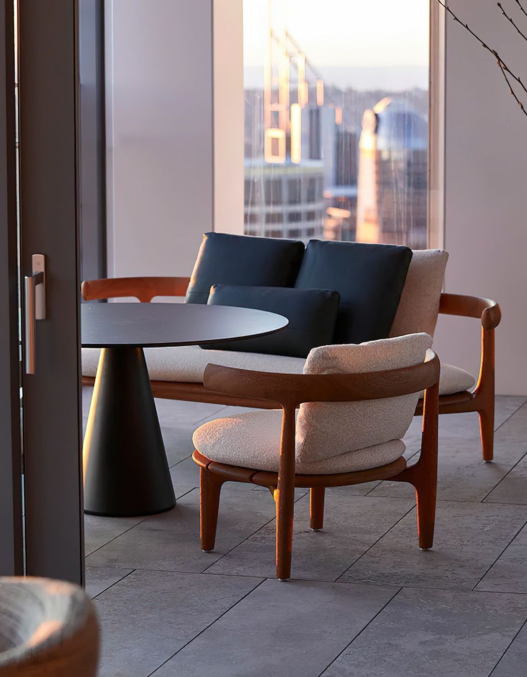The Jove coffee table designed by Draga and Aurel, with the Himba Little Armchair and Sofa by Roberto Lazzeroni, both by Baxter. Photo © Martin Mischkulnig