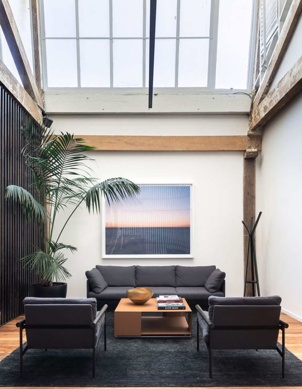 A calming aesthetic is created in Textile Lofts by Urry + Burgess Construction with the use of nature-inspired wall art.