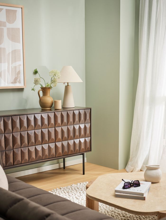 Create depth in your living room by enhancing your panelling with a stronger hue to your walls.