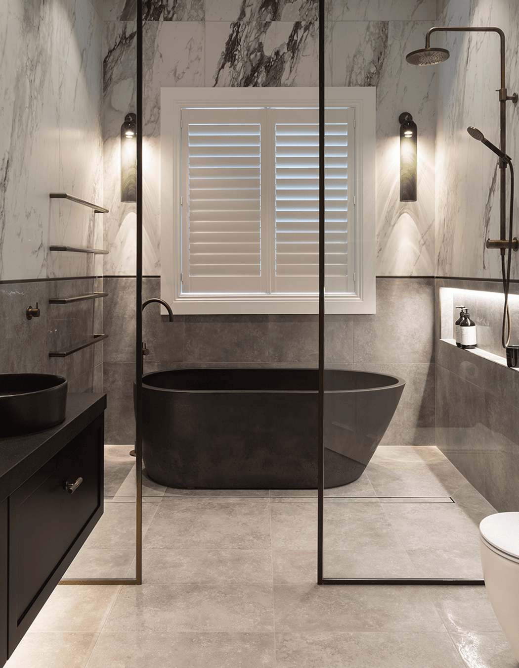 In this residential bathroom, Sticks + Stones Design used Quantum's large-format Italian Carrara 900 x 1800mm tiles from the popular Bianco collection.