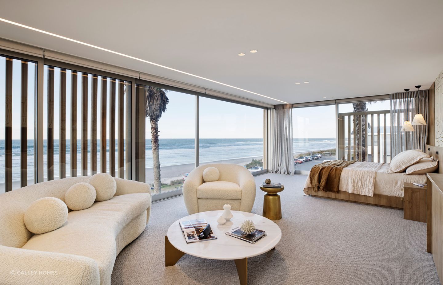 A bedroom with its own personal living space, seen here in this stunning coastal home in Mt Maunganui, will make it a much more comfortable place to spend time. | Photography: Amanda Aiken