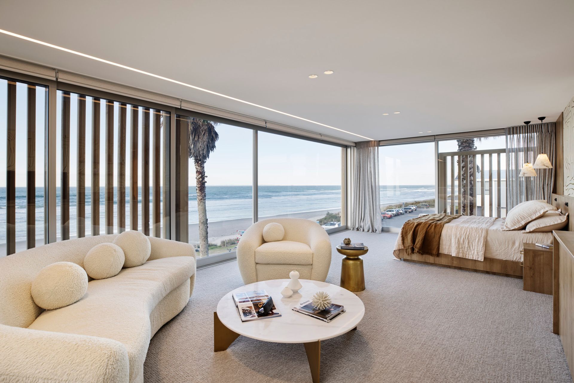 A bedroom with its own personal living space, seen here in this stunning coastal home in Mt Maunganui, will make it a much more comfortable place to spend time. | Photography: Amanda Aiken