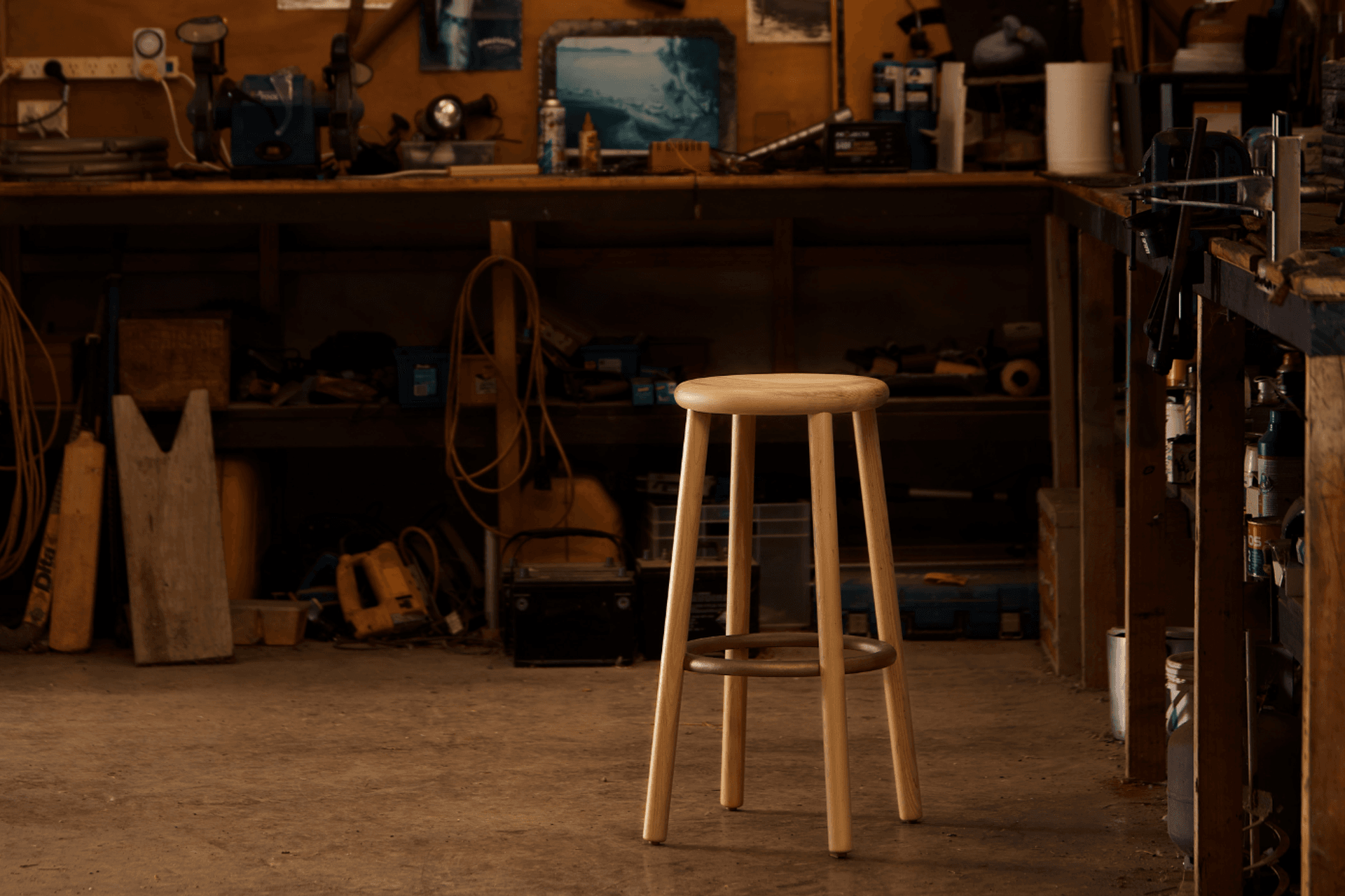 The Double Happy was designed in 2012, aiming to express the most fundamental characteristics of one of the oldest pieces of furniture: a place to sit. A bold, substantial seat for daily use. The cast bronze ring anchors four American ash legs to the wide, contoured seat.