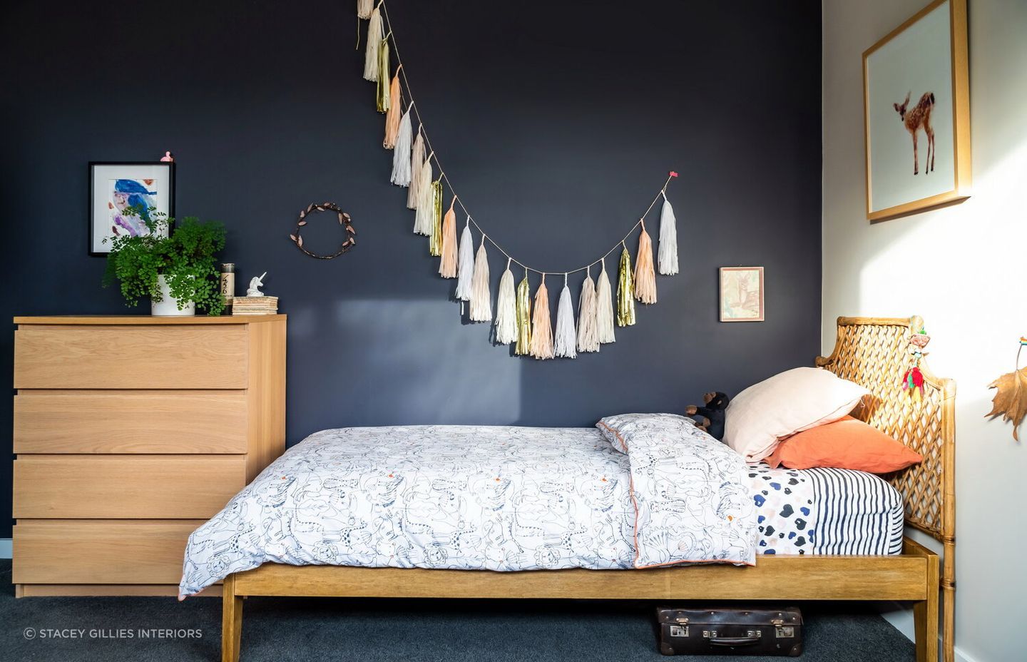 Just a little bit of greenery brings freshness to this beautifully designed children's room by Stacey Gillies Interiors.