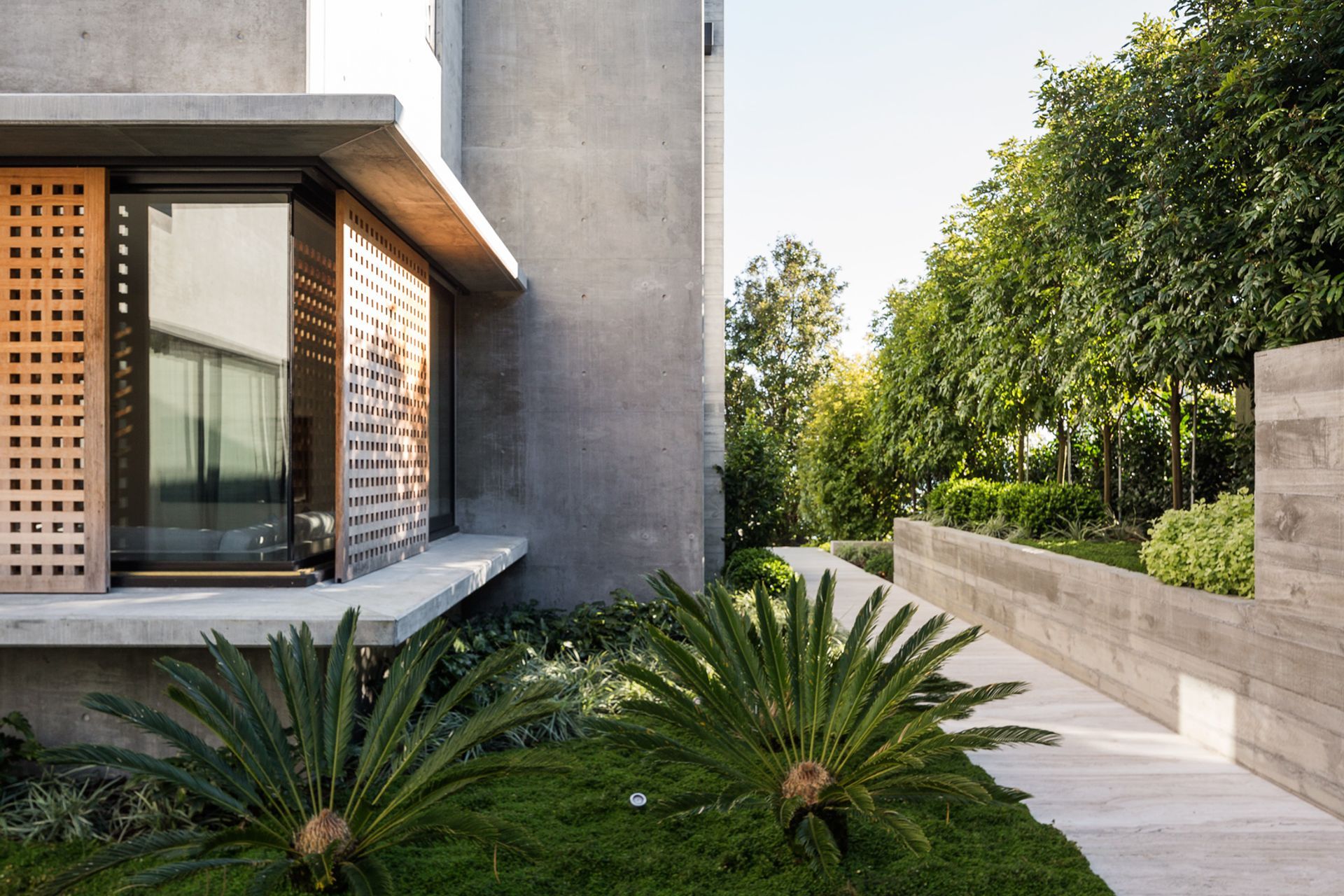 A bold contrast of building and landscaping materials has a striking impact on one and all.
