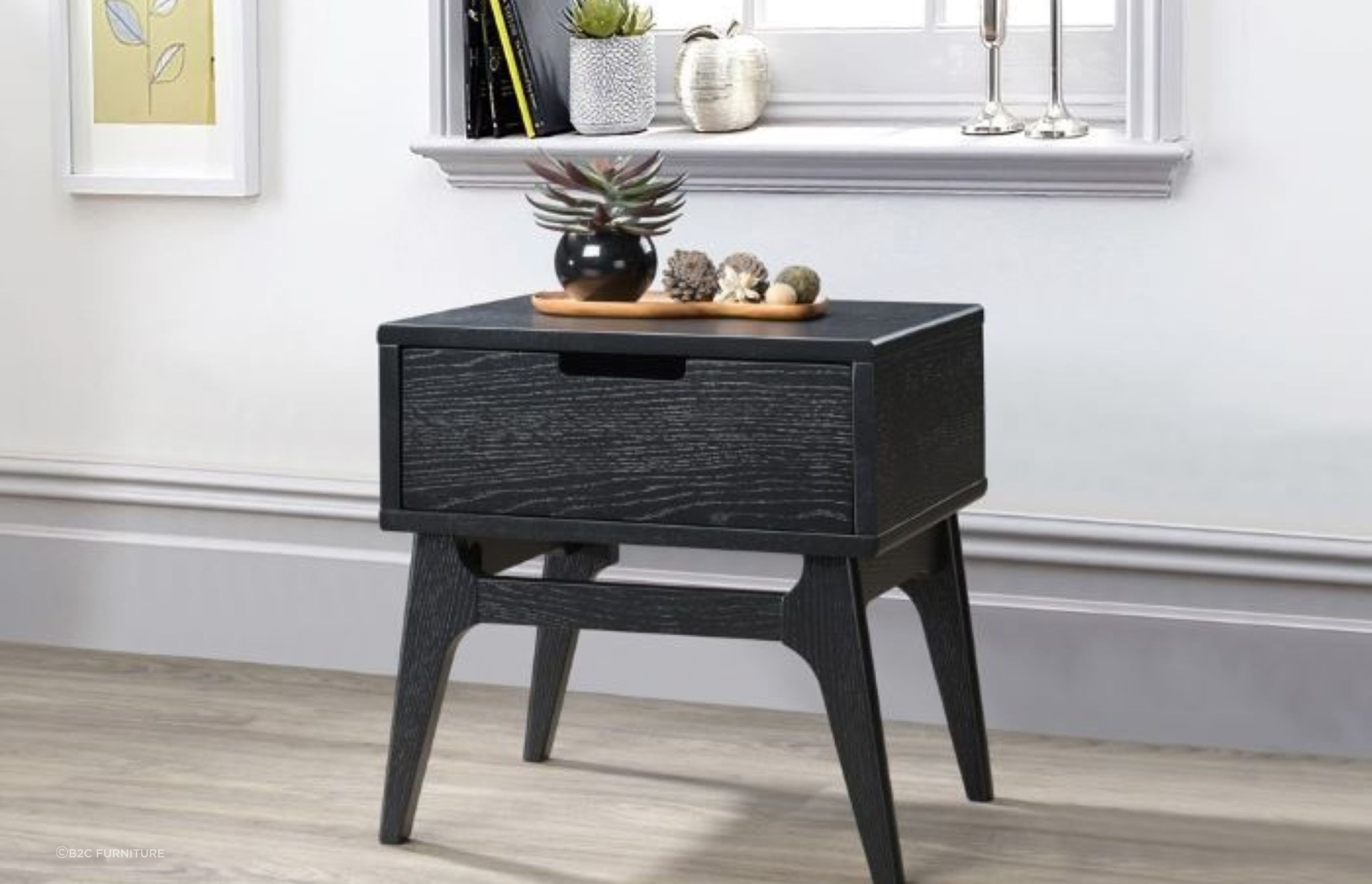 Hardwood side tables, such as this Paris Hardwood Bedside Table, are popular due to their durability and sturdiness.