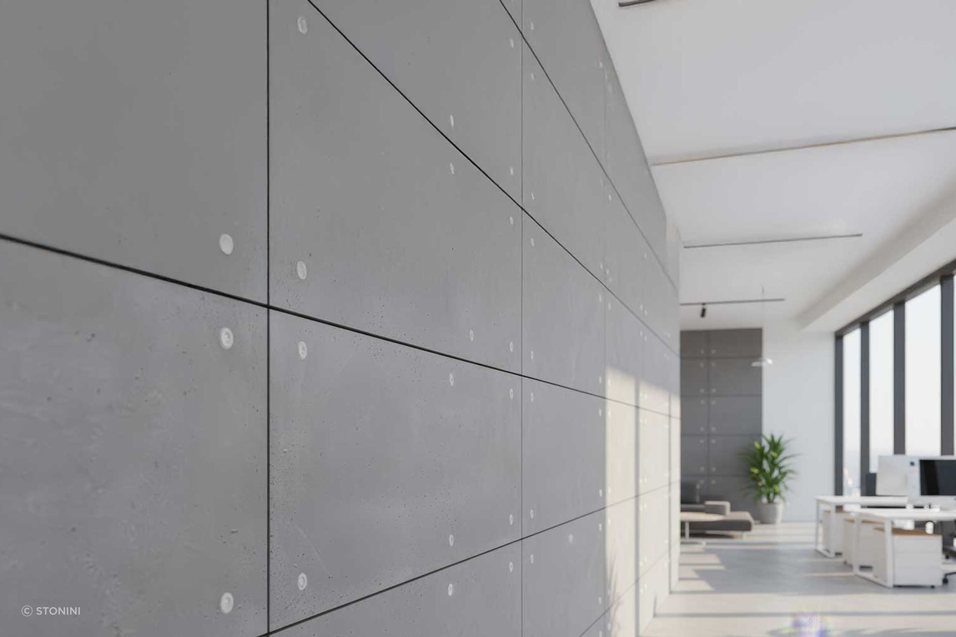 A detailed perspective on eco-friendly concrete panels within a sunlit contemporary office