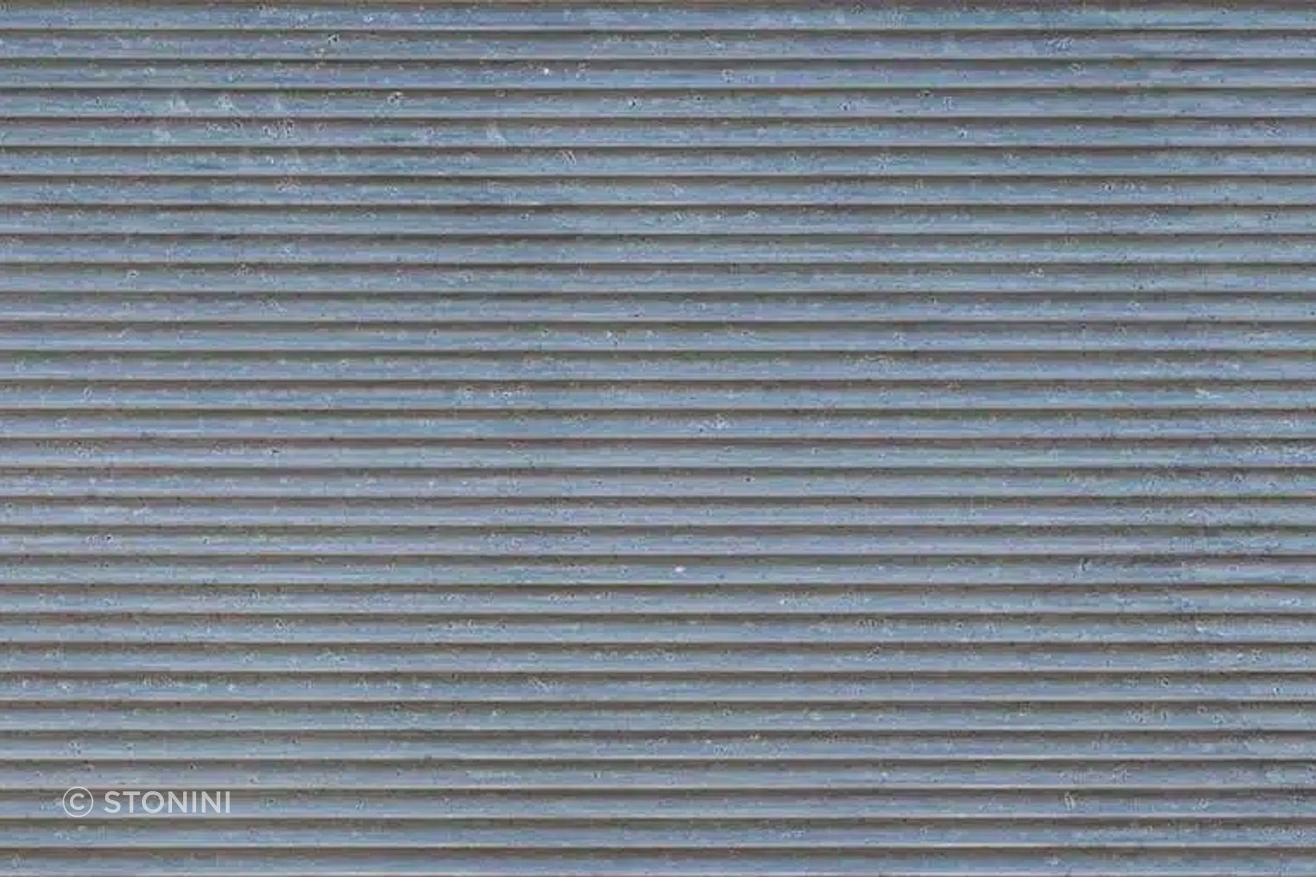 “Pitted Flautas” from Stonini emulates corrugated 3d concrete