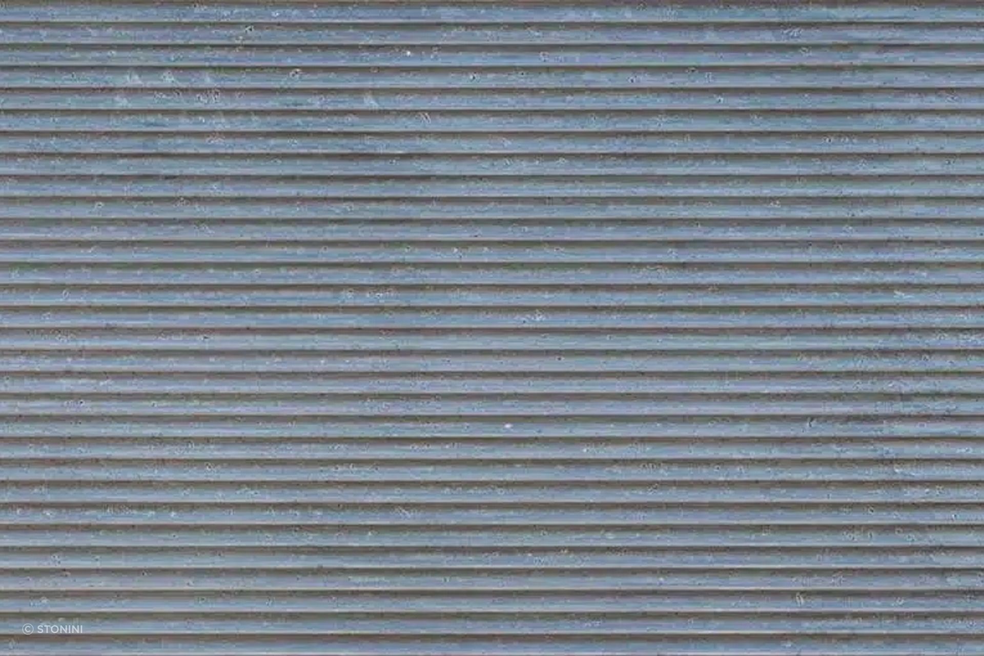 “Pitted Flautas” from Stonini emulates corrugated 3d concrete