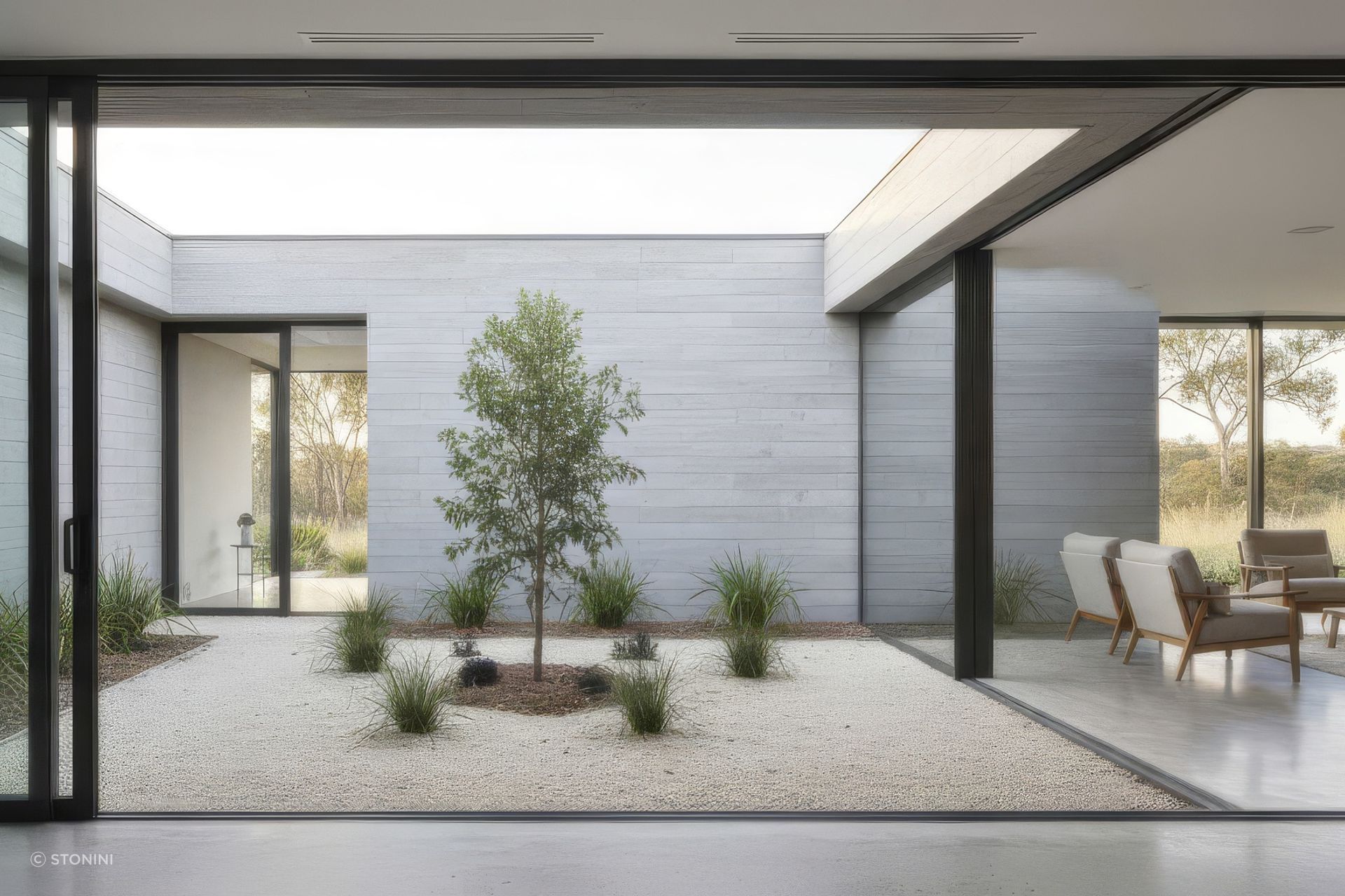 Central open courtyard with board formed concrete wall panels (Conceptual rendering).