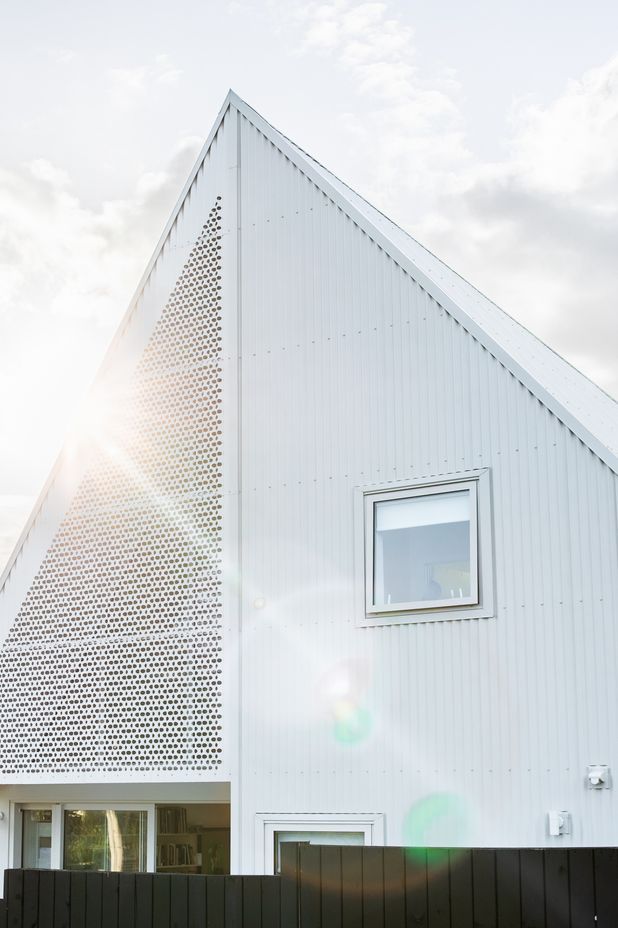 The paper house resembles a paper dart from the outside, and carefully folded origami on the interior.