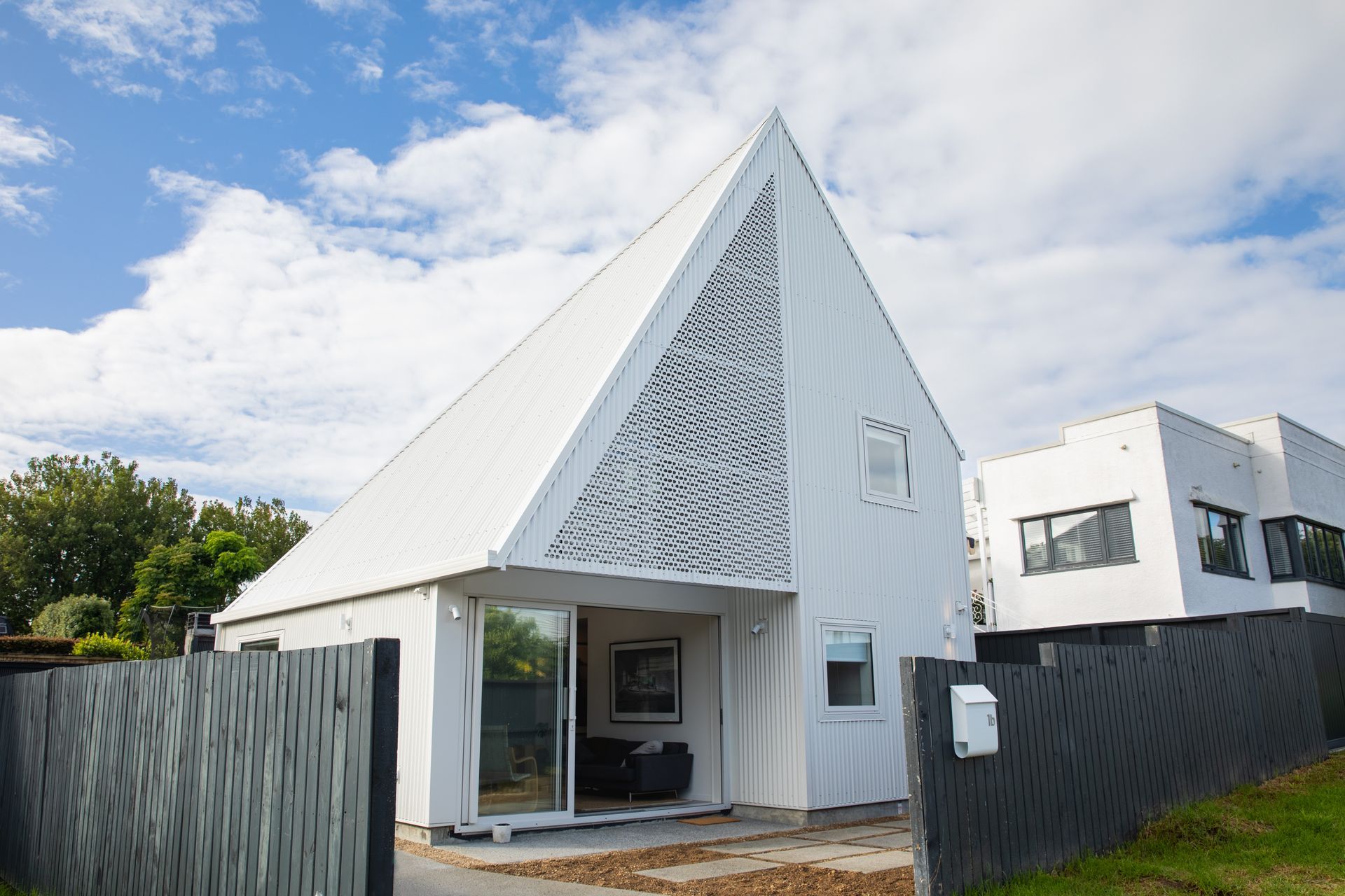 The Paper House was created to resemble folded paper and makes the most of a very compact site.