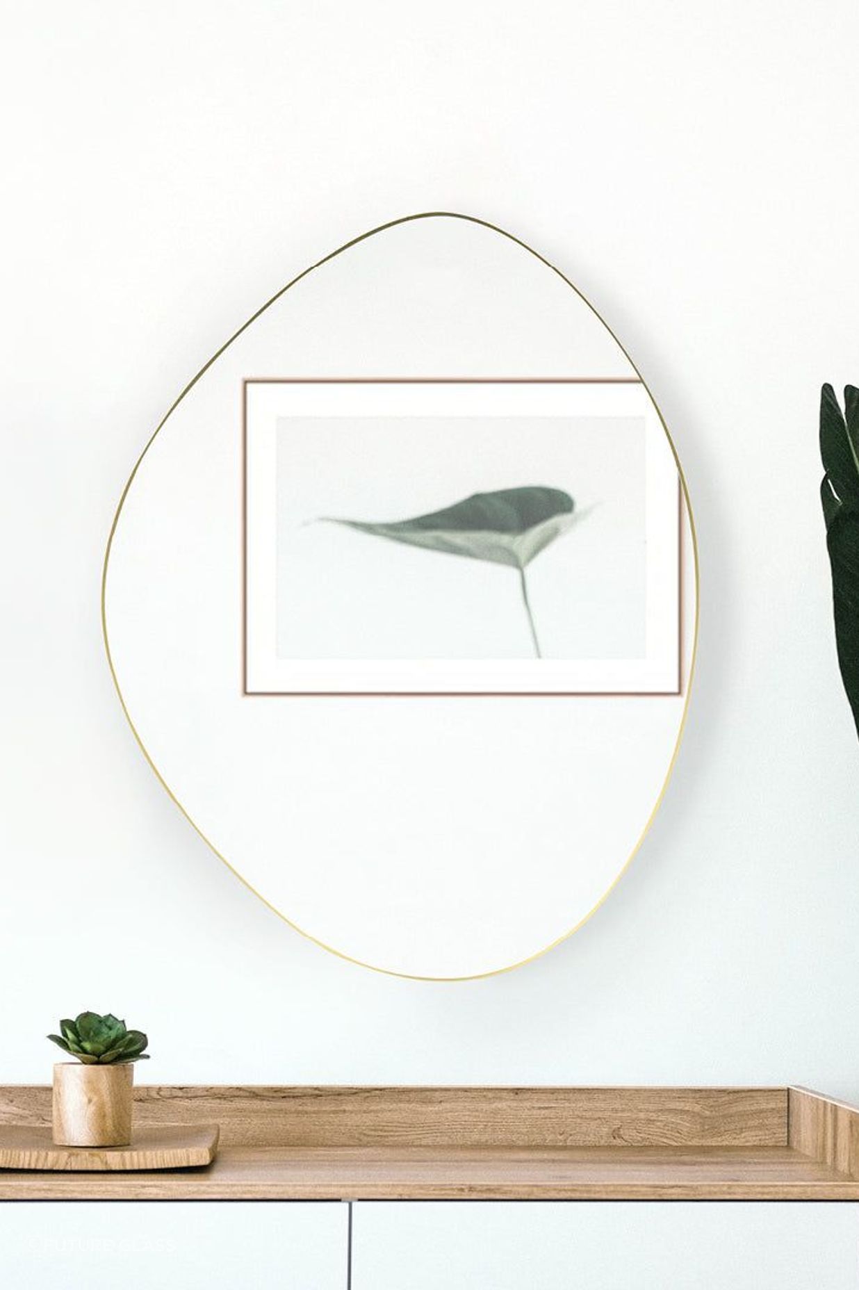 A pebble-shaped bathroom mirror that adds a touch of nature-inspired design to a bathroom. Featured product: Pebble Shape Mirror