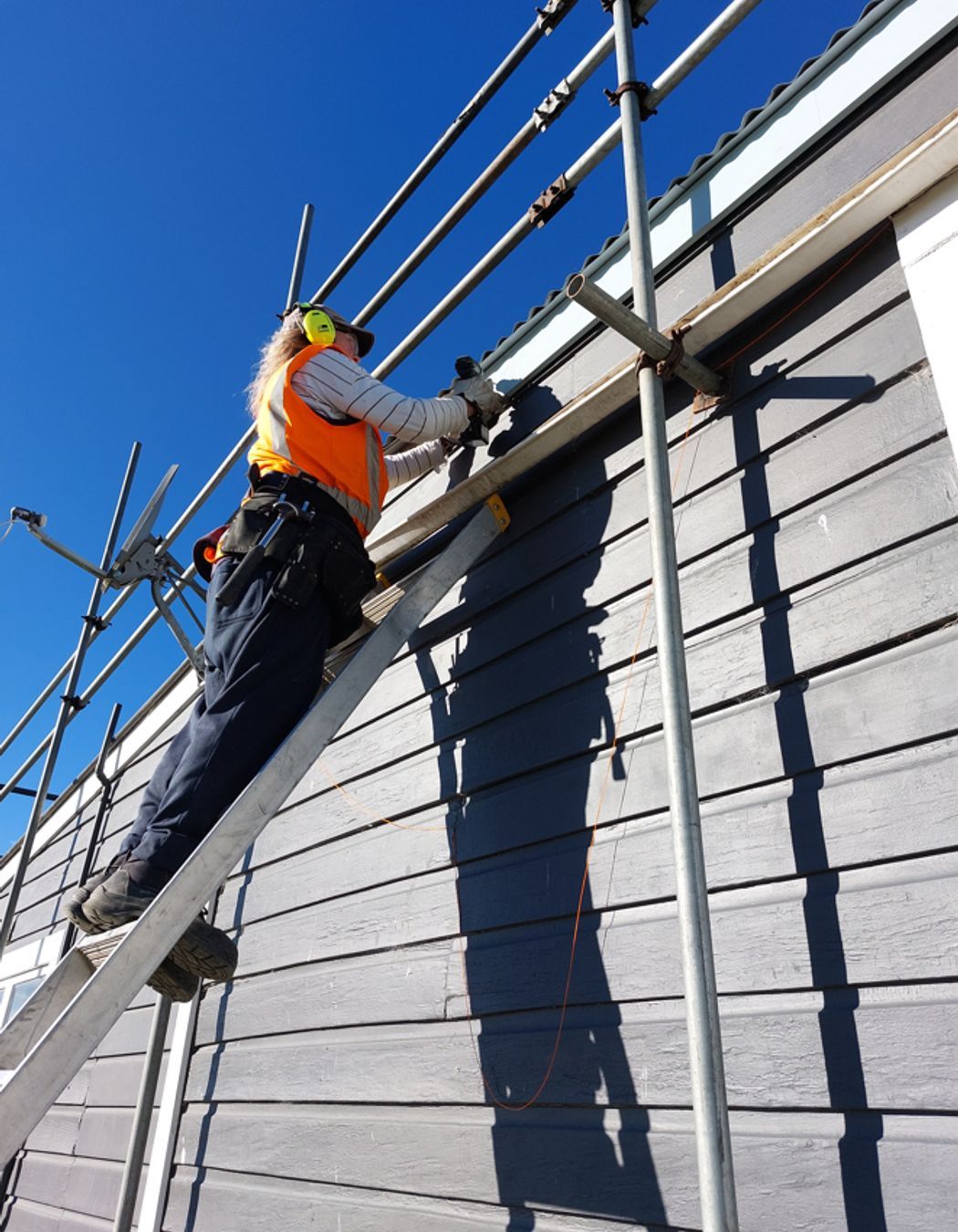 Jeffrey Dennison Builders mid-way through fascia board installation on a residential roofing project.