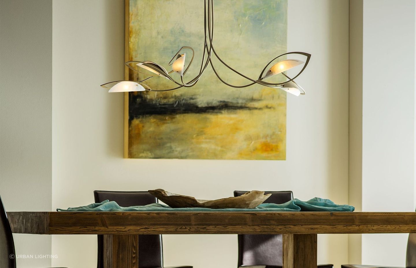 The Aerial Pendant is a sleek and luxurious example of lighting that strikes an artistic balance of materials and style