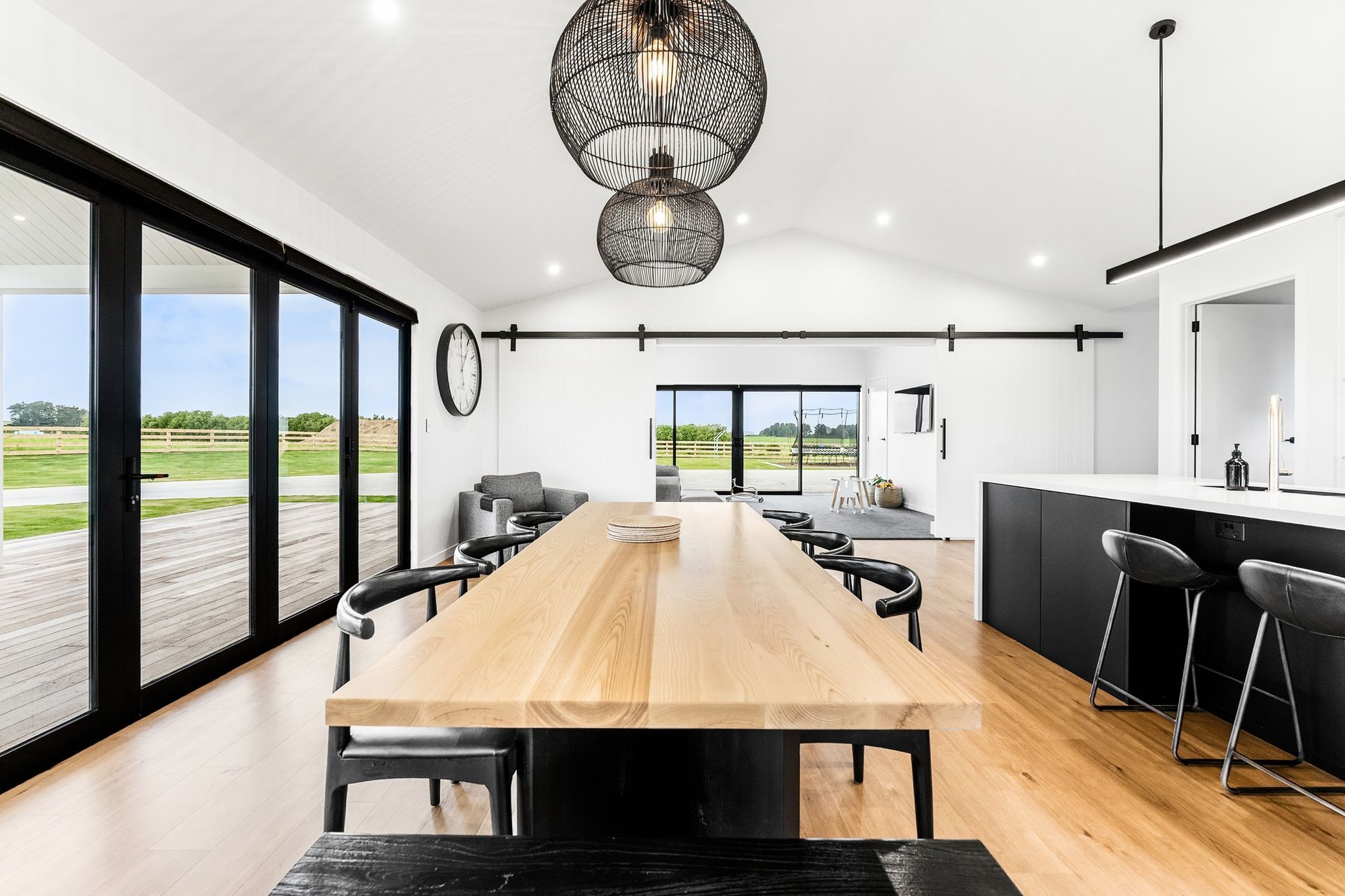 Alyssa choose a set of AR41 barn doors with black tracks and hardware to close off the wide entrance to the second living/playroom.