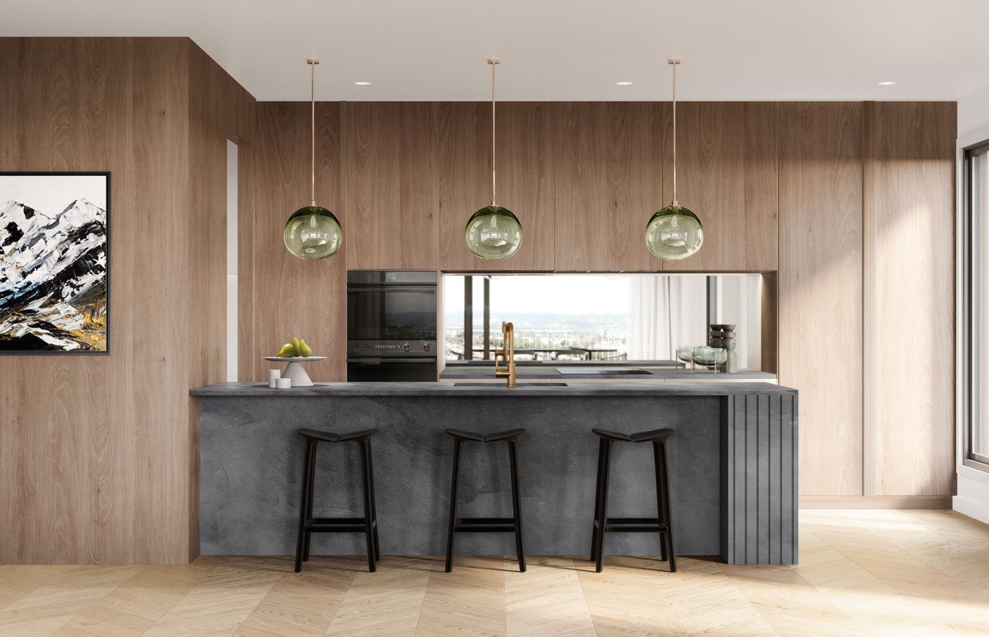 Monmouth Glass pendant lights hang over a charcoal slate benchtop.