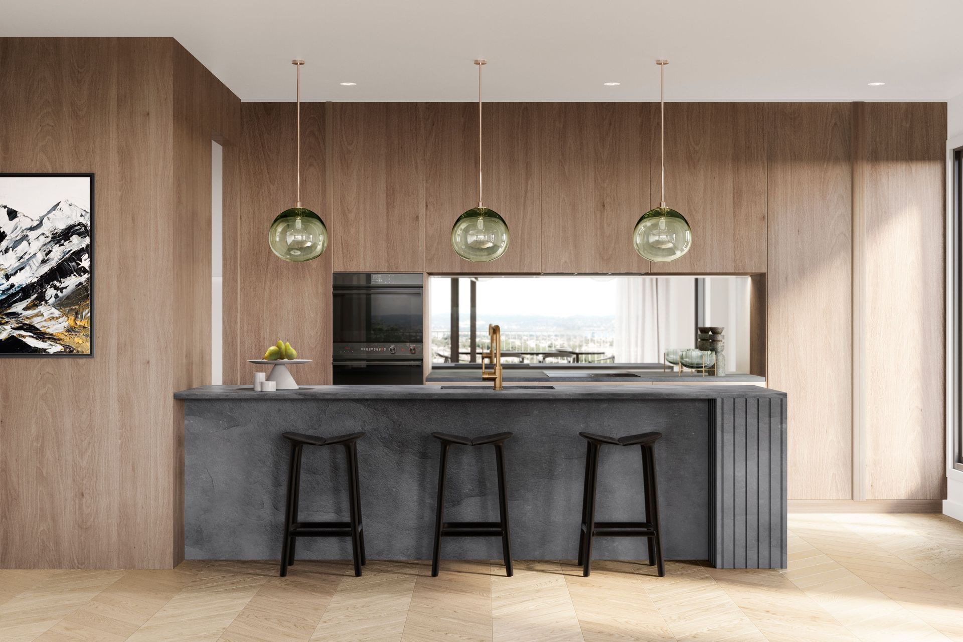 Monmouth Glass pendant lights hang over a charcoal slate benchtop.