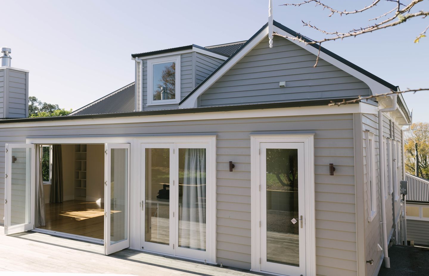 Walls were moved internally to create more space, and a new deck was added to extend the upstairs living area.
