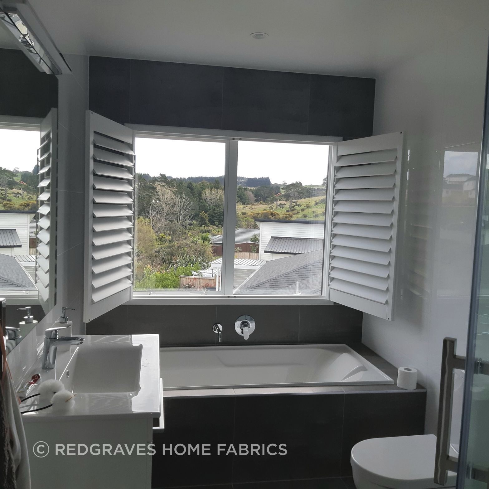 open hinged shutter in bathroom