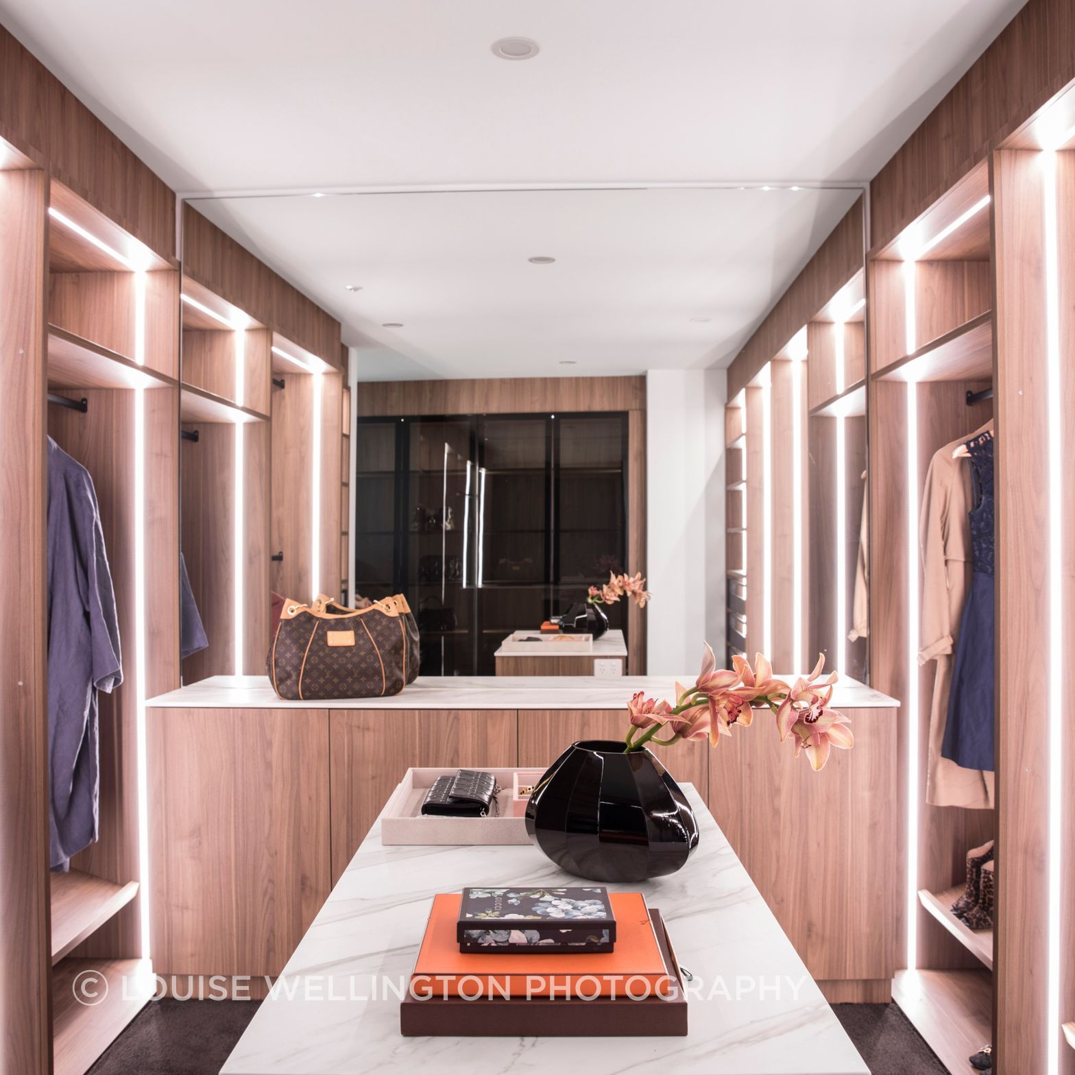 Oxford Project. Walk in Robe and dressing room with warm timbers, functional lighting plan and Neolith clad dressing tables is the epitomy of luxury.