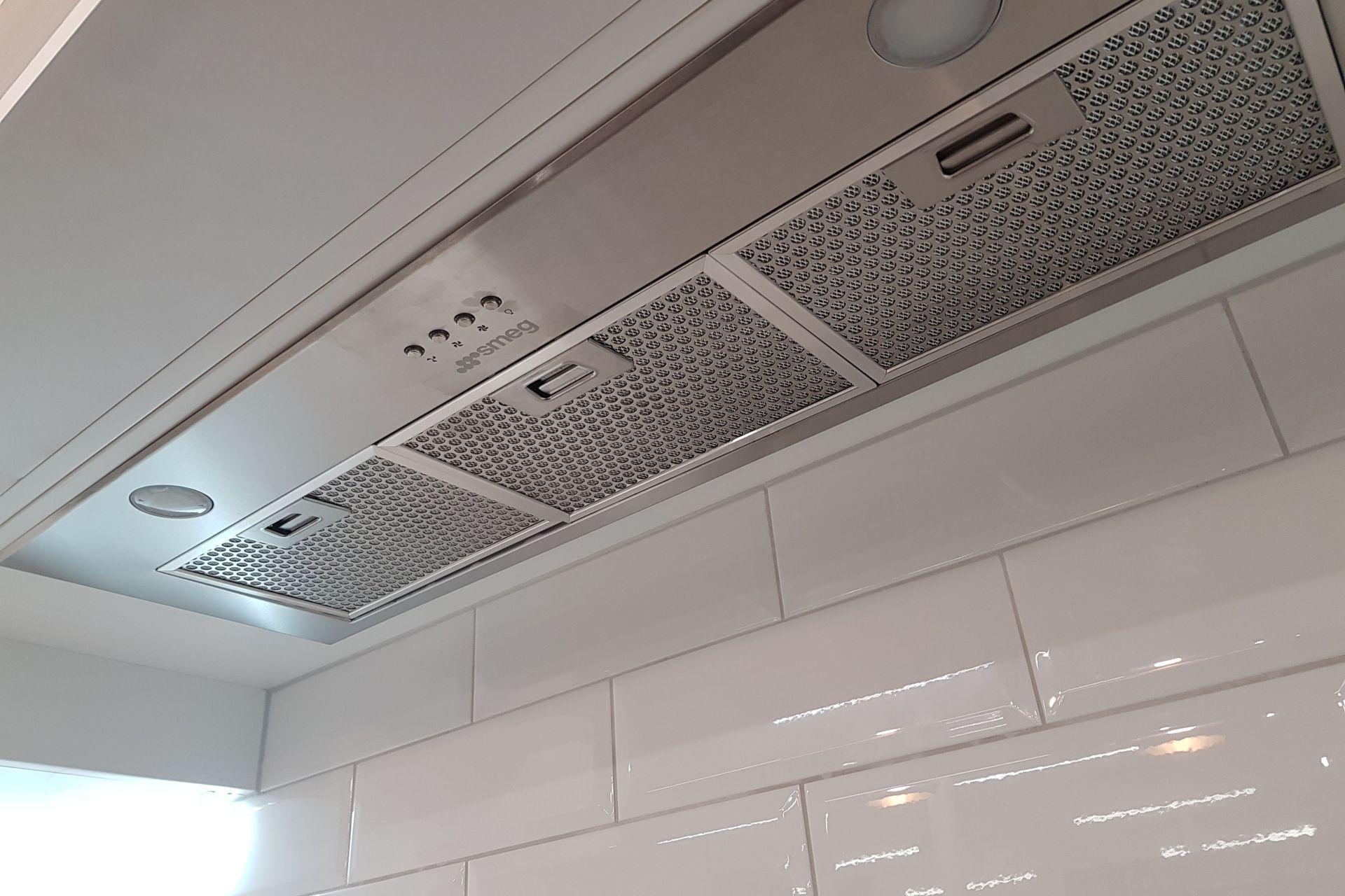 The hooded chimney is made above the SMEG over head rangehood