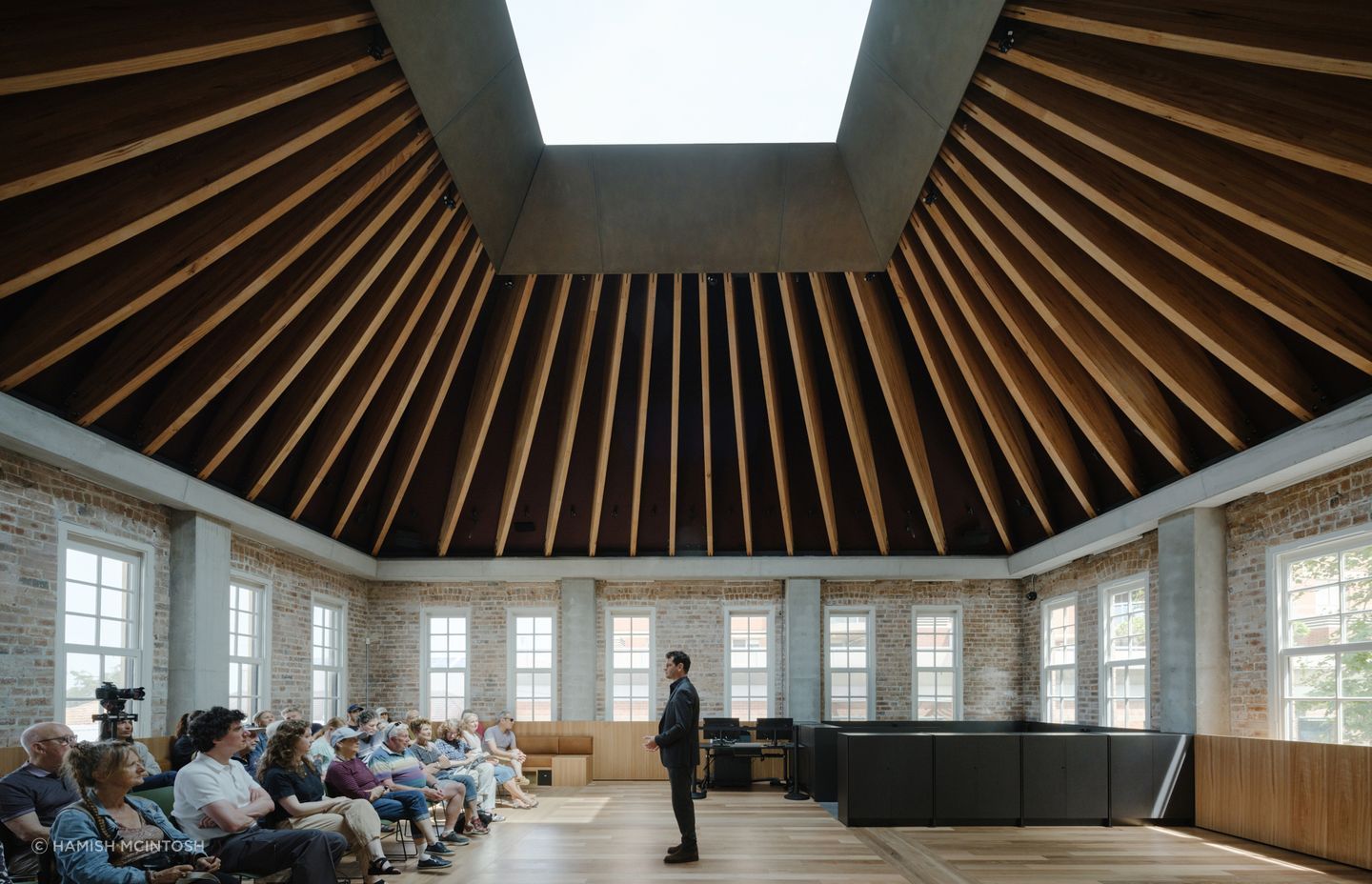 Stunning tapered ceiling beams made from MASSLAM and fabricated by TGA Engineers, leading to a vast skylight at the restored Boot Factory building in Bondi Junction. Image Hamish McIntosh