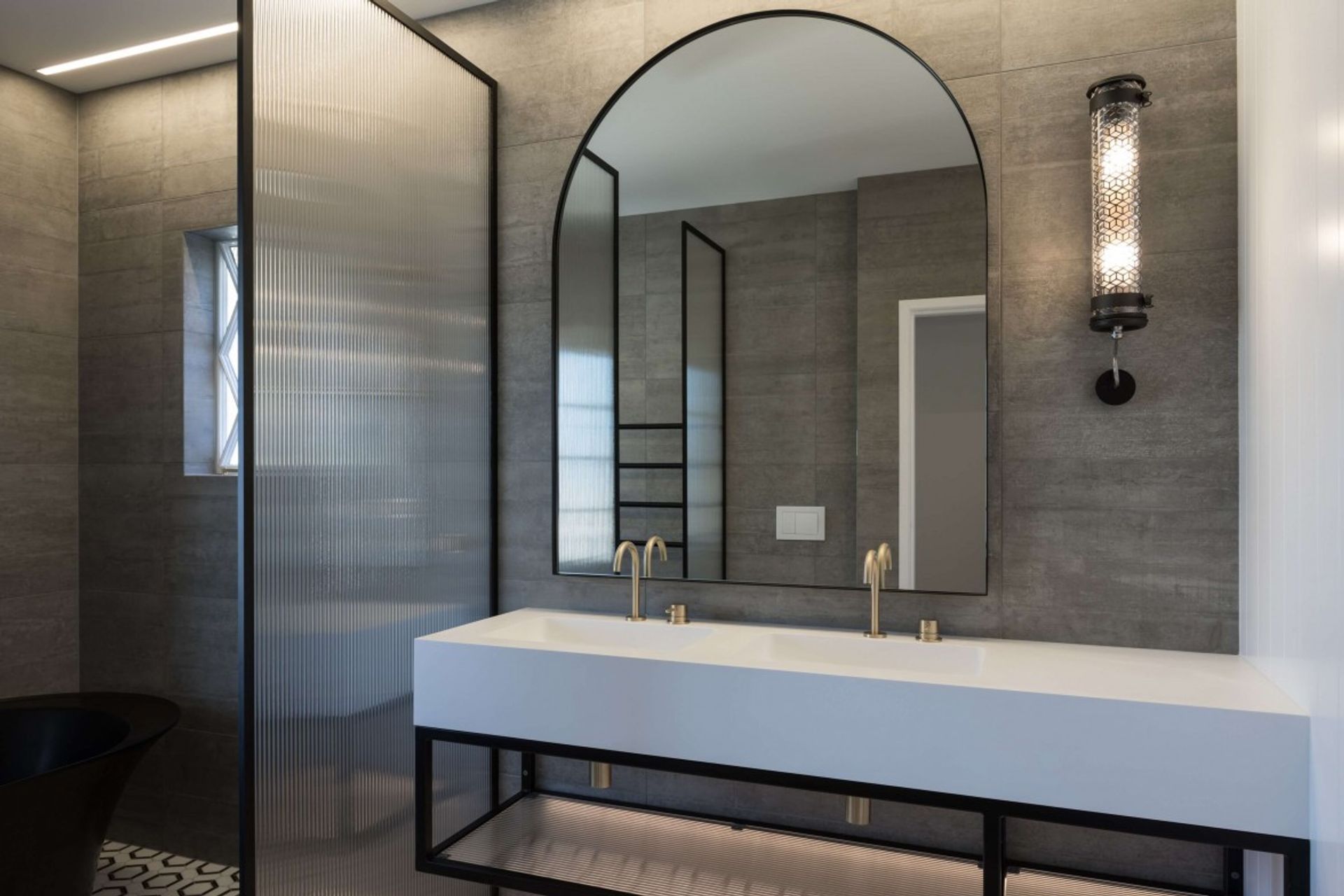 This reeded glass shower screen from Crest Showers looks stunning framed in black.