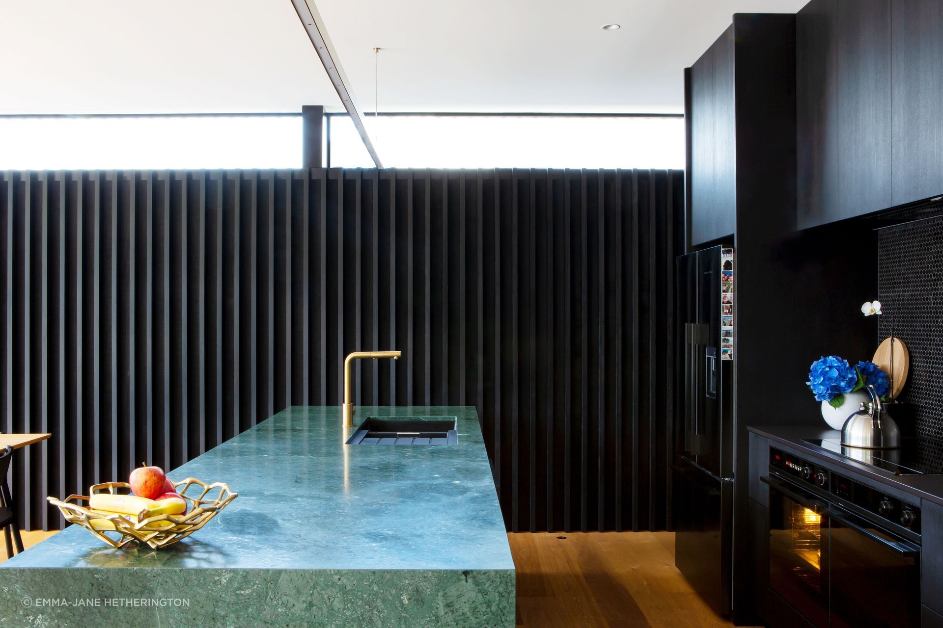The Buddy mixer is from Plumbline and the appliances are Fisher & Paykel. Dorrington Atcheson Architects project architect Sam Lennon first suggested the green marble island even though previous clients had shied away from such a bold statement.