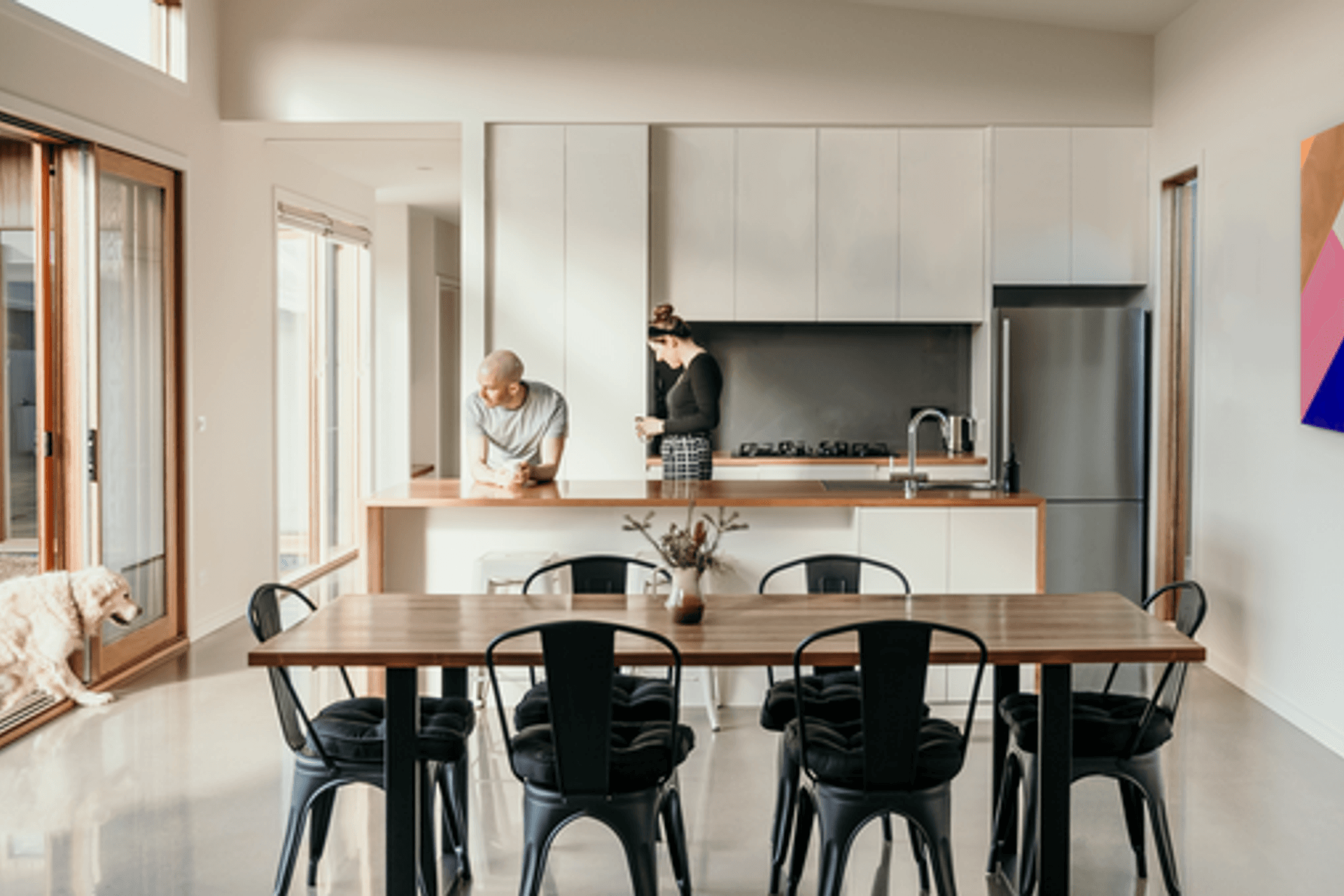 Image: High ceilings and light filled living areas in the L Shape House.