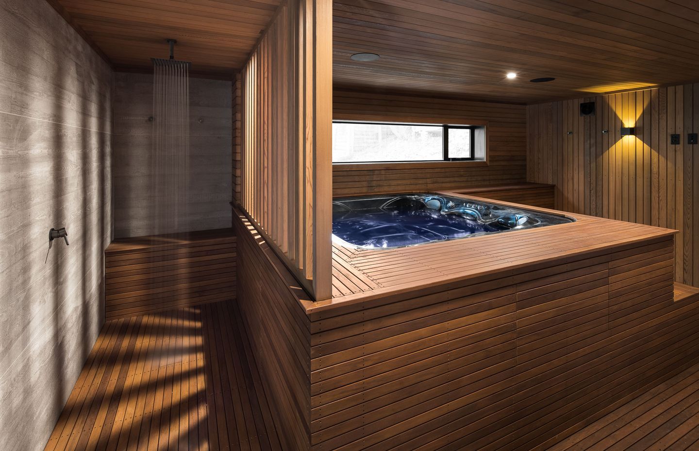 The outdoor shower and spa pool, two contemporary introductions that lend the luxury of modern living.