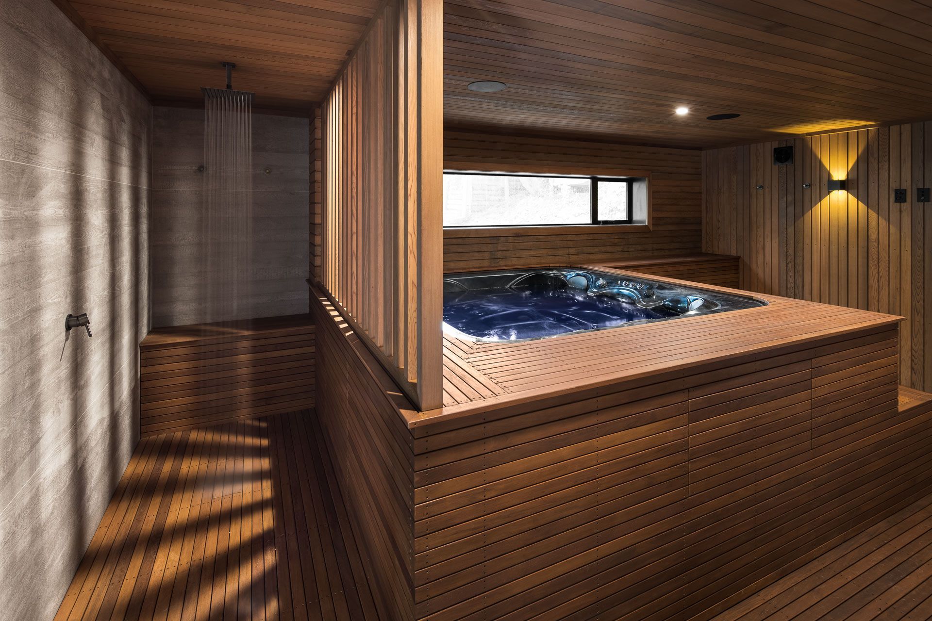 The outdoor shower and spa pool, two contemporary introductions that lend the luxury of modern living.