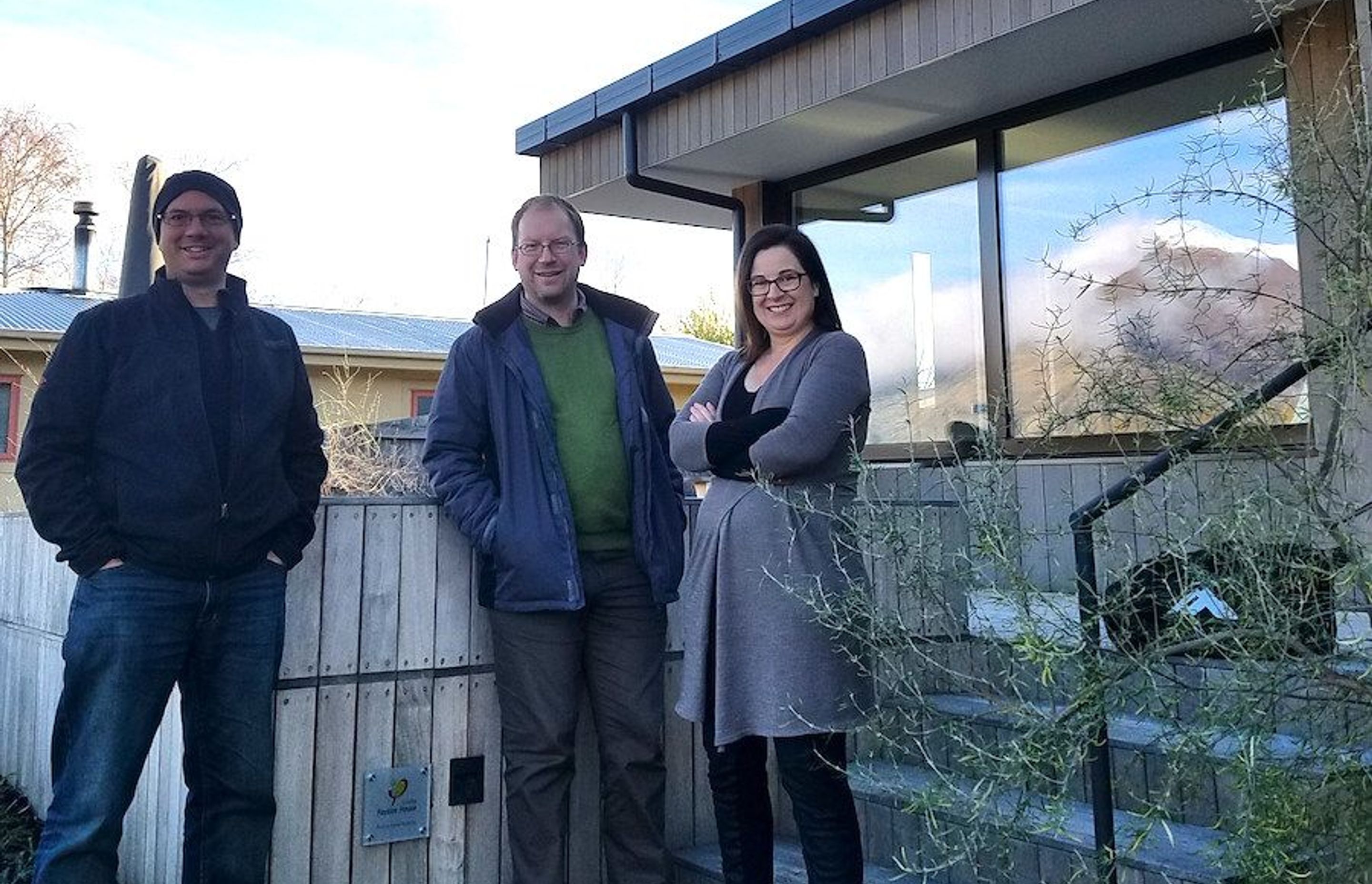 Jason Quinn (far left) in front of certified Passive House in Wanaka (Credit: Sustainable Engineering)

