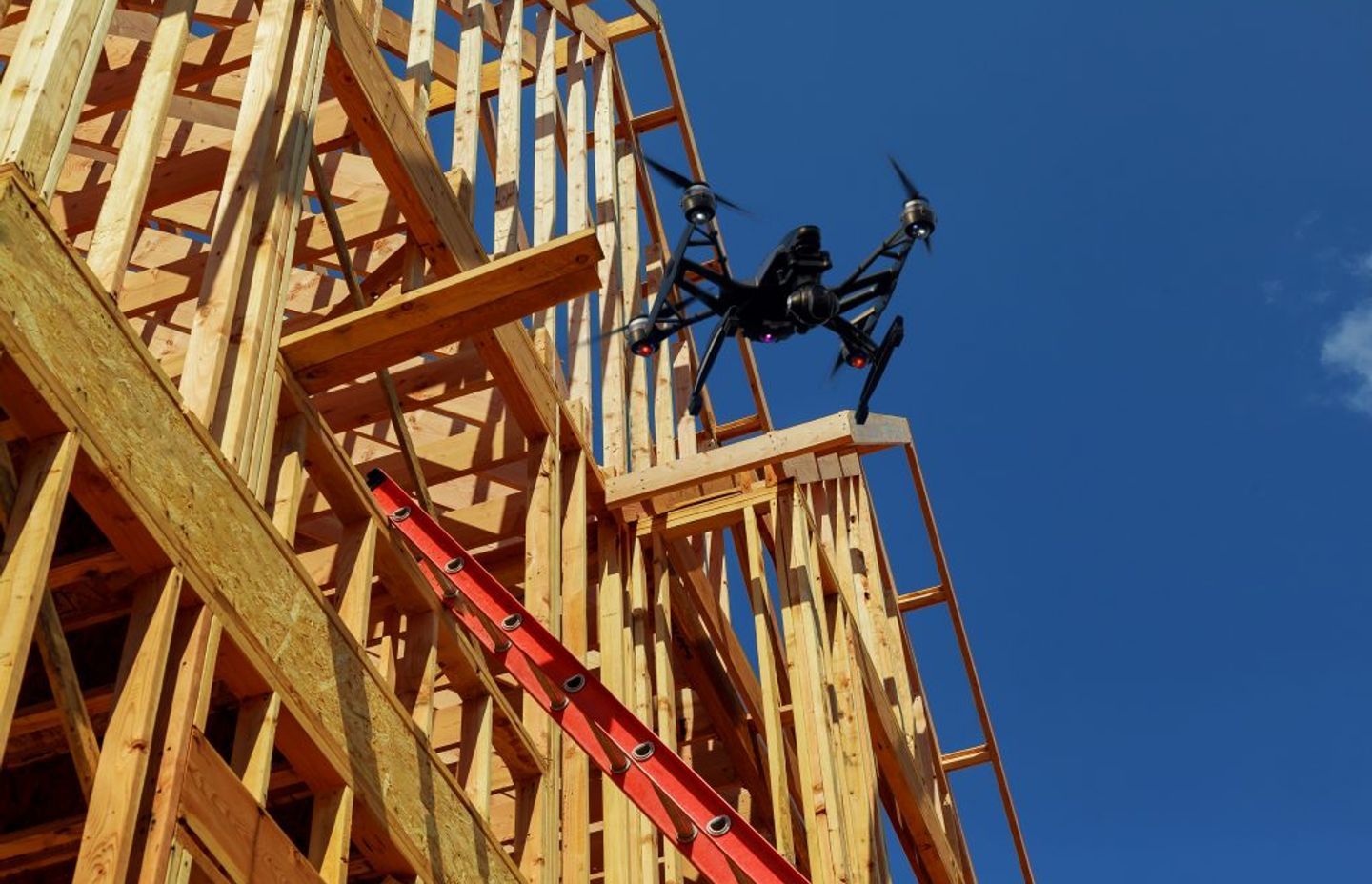 A drone flying over a building site. Image Shutterstock