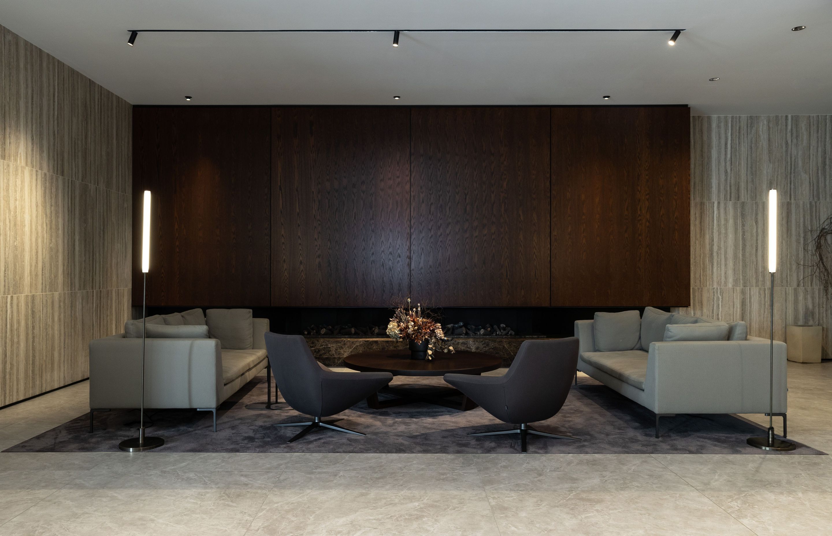 The formal 'lounge area' features the Charles sofa by Antonio Citterio, the Xilo low table in smoked oak and a pair of Jeffrey Bernett Metropolitan swivel chairs—all from B&amp;B Italia.
