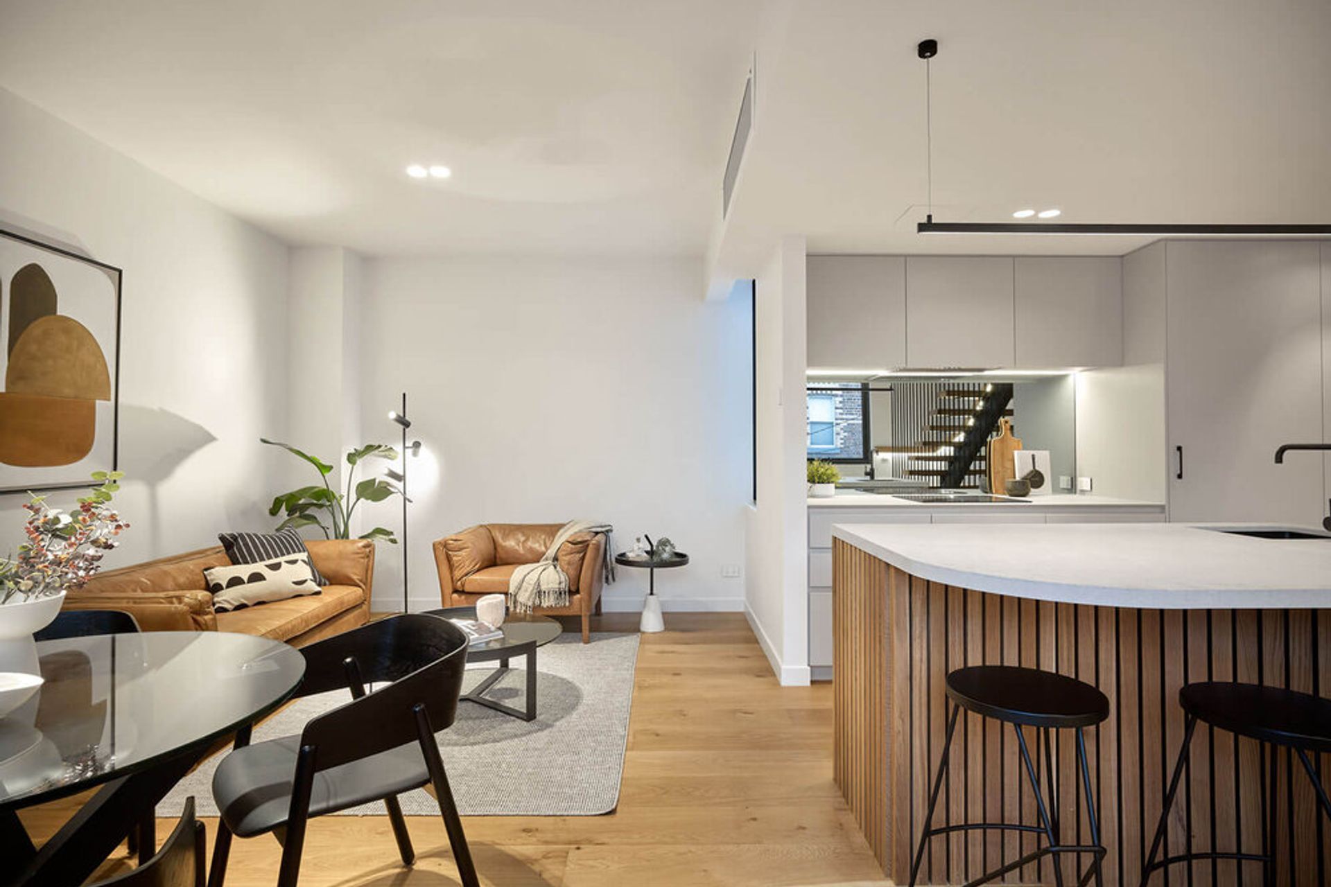 The kitchen and living spaces seamlessly blend together.